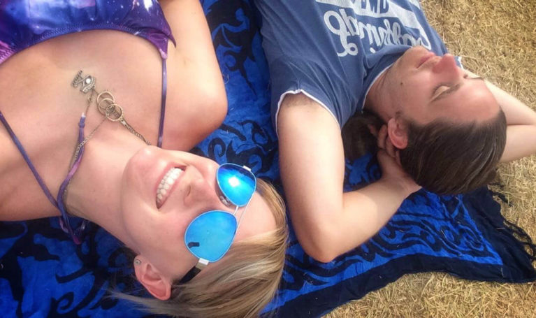 Lindsay and Robin Napping in a Quiet Corner of the Festival Grounds :: I've Been Bit! Travel Blog