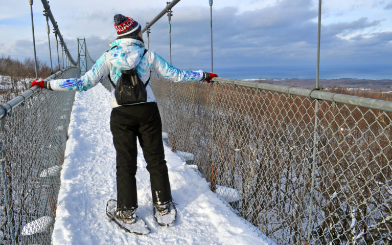 Lindsay Snowshoeing the Suspension Bridge at Scenic Caves in the Winter :: I've Been Bit! Travel Blog
