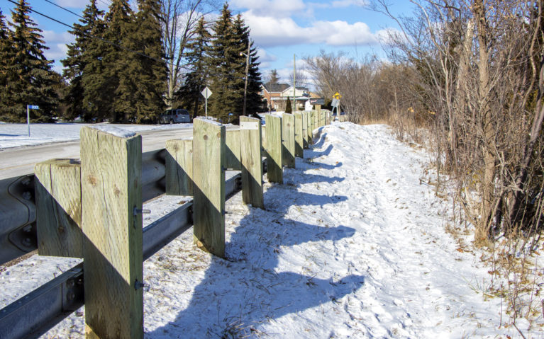 Snowy Trail Beside a Road Barrier :: I've Been Bit! Travel Blog