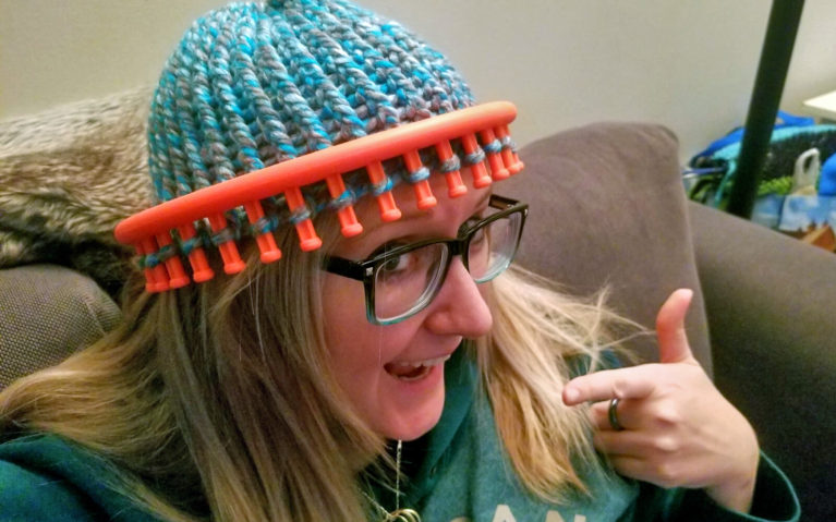 Offline Hobbies are Important, too! Here I am measuring my hat I'm knitting :: I've Been Bit! A Travel Blog