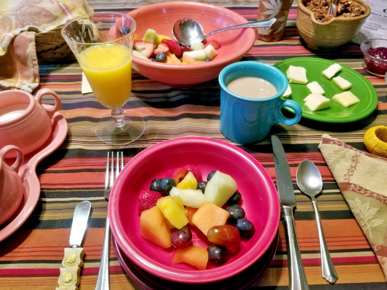 Breakfast Spread on Table including Fruit, Yoghurt, Granola, Coffee and Juice :: I've Been Bit! Travel Blog