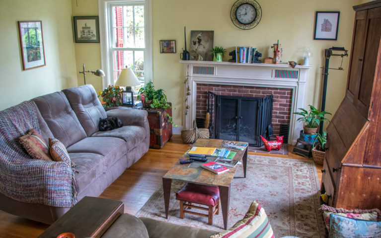 Common Room with Couches, Table and Fireplace Downstairs in the Inn :: I've Been Bit! Travel Blog