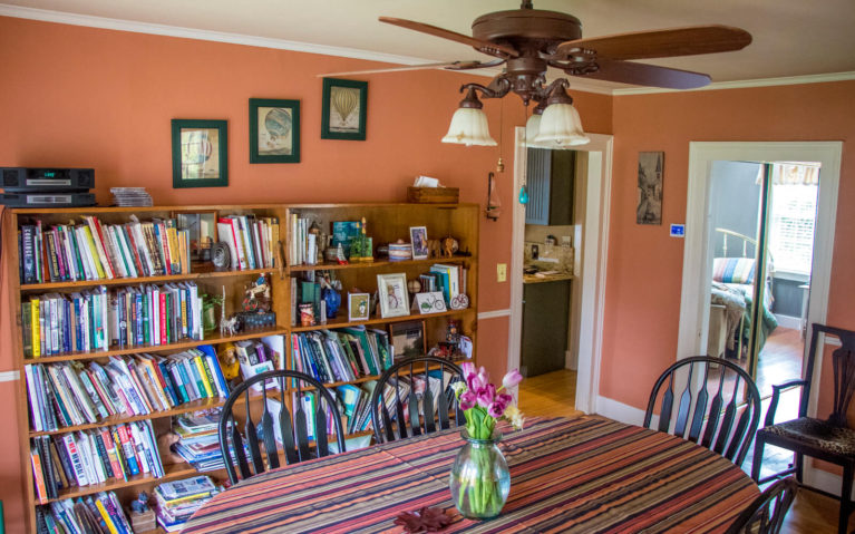 Dining Room with Table, Ceiling Fan and Huge Bookshelf :: I've Been Bit! Travel Blog