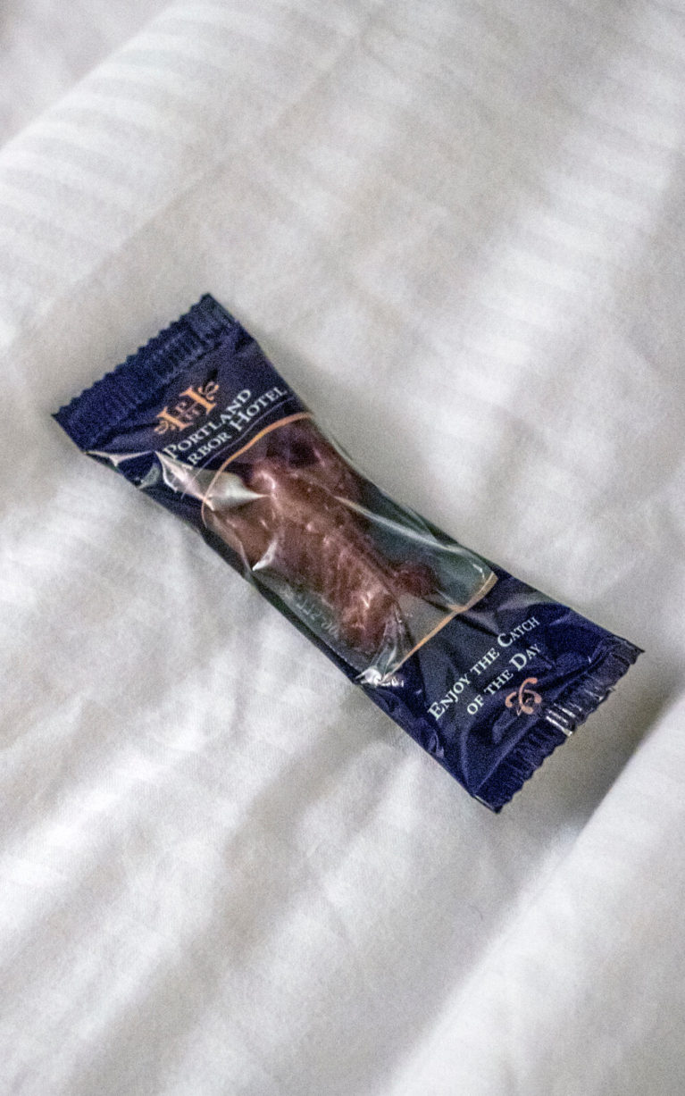 Lobster-Shaped Chocolate in Wrapping on Bed at Portland Harbor Hotel :: I've Been Bit! Travel Blog