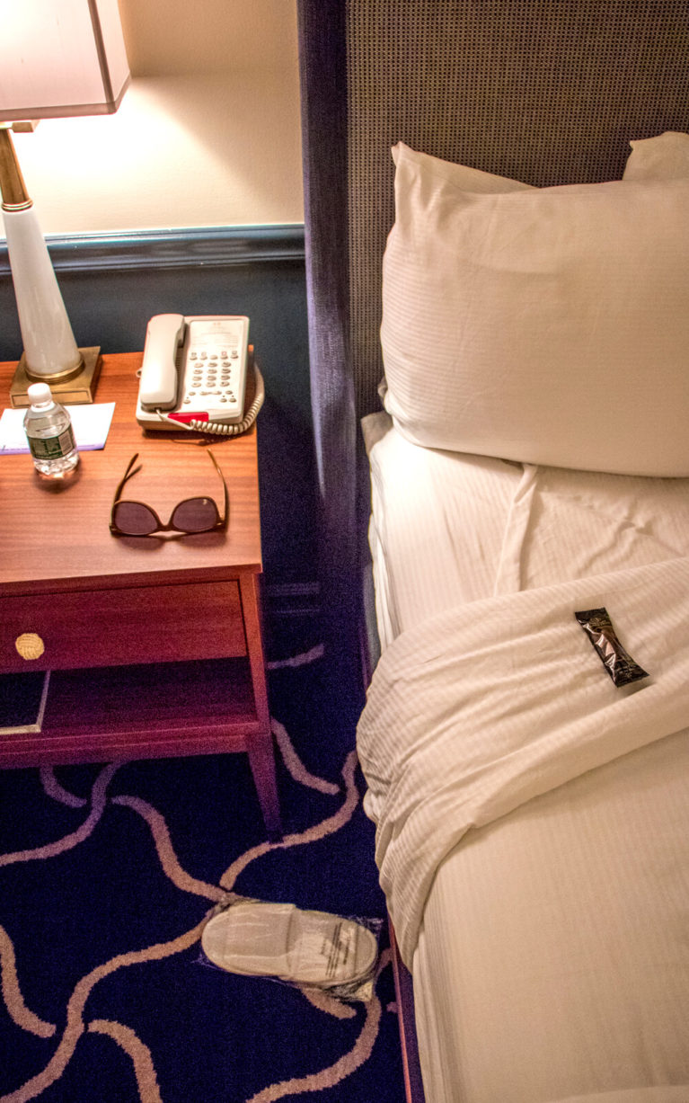 View of the Bed with Chocolate, Slippers and Bottle of Water On It :: I've Been Bit! Travel Blog