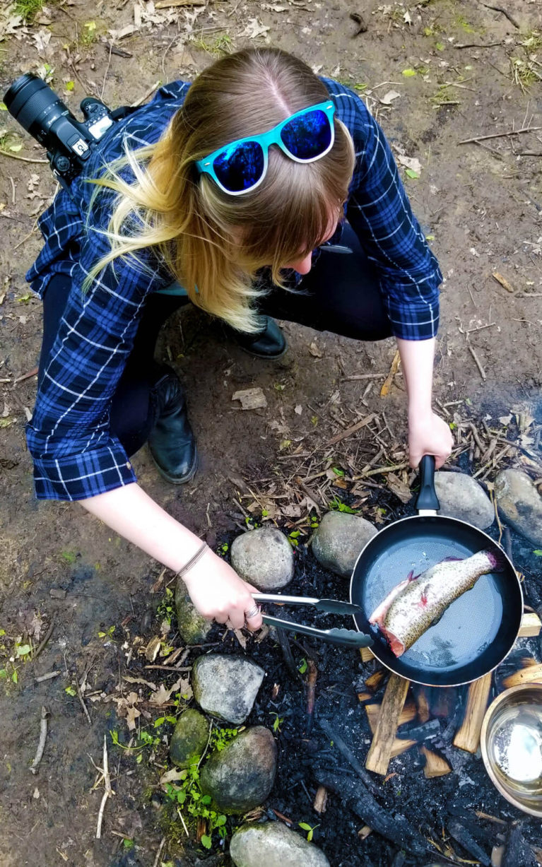 Lindsay Cooking a Trout over the Campfire in the Woods :: I've Been Bit! Travel Blog