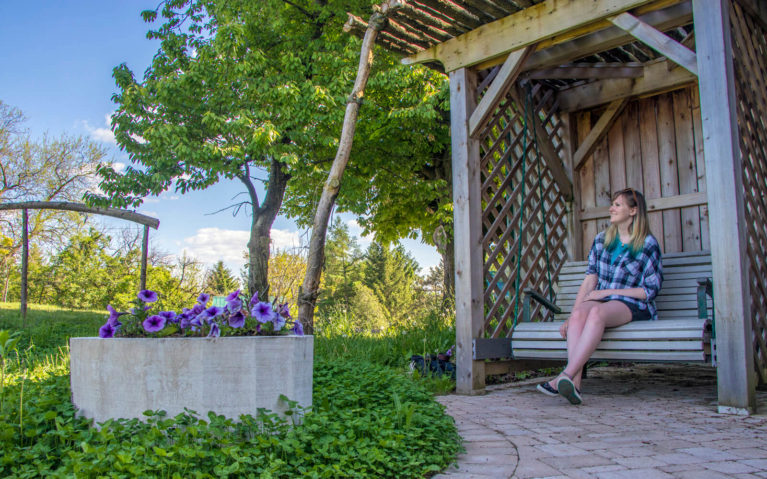 Lindsay Taking a Moment to Enjoy the Country Air in Perth County on Organic Oasis' Pollinator Patio :: I've Been Bit! Travel Blog