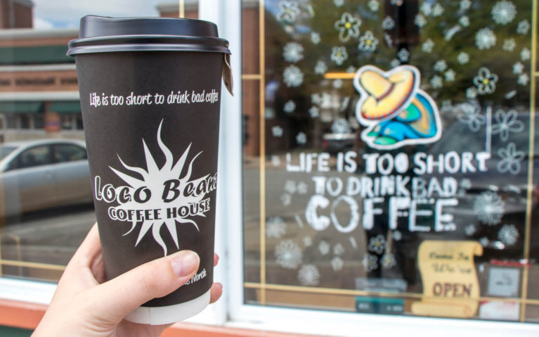 Cup With Loco Beanz Logo In Front of Little Current Store Front :: I've Been Bit! Travel Blog