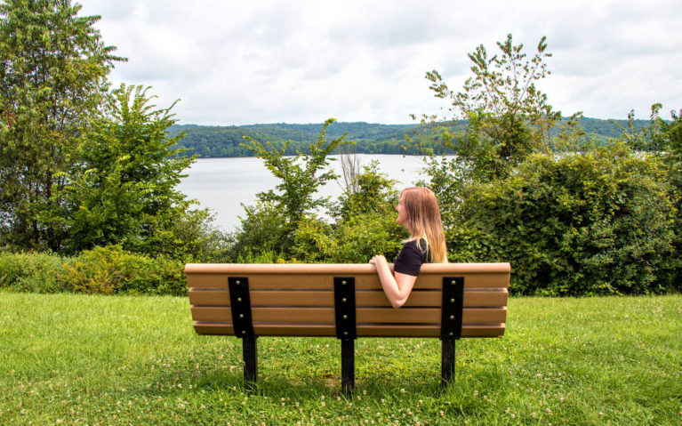 Lindsay Sitting on a Bench in Moraine State Park :: I've Been Bit! Travel Blog