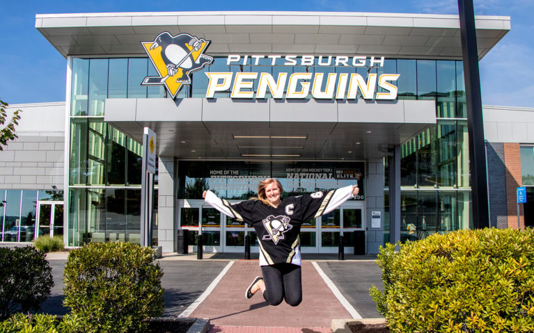 Jump Shot of Lindsay in front of the UPMC Lemieux Sports Complex :: I've Been Bit! Travel Blog