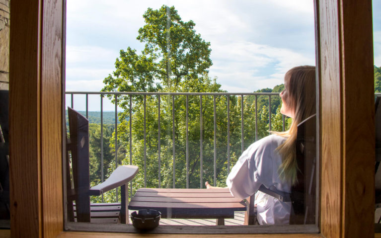 Lindsay Sitting on Her Balcony at the Seven Springs Mountain Resort :: I've Been Bit! Travel Blog
