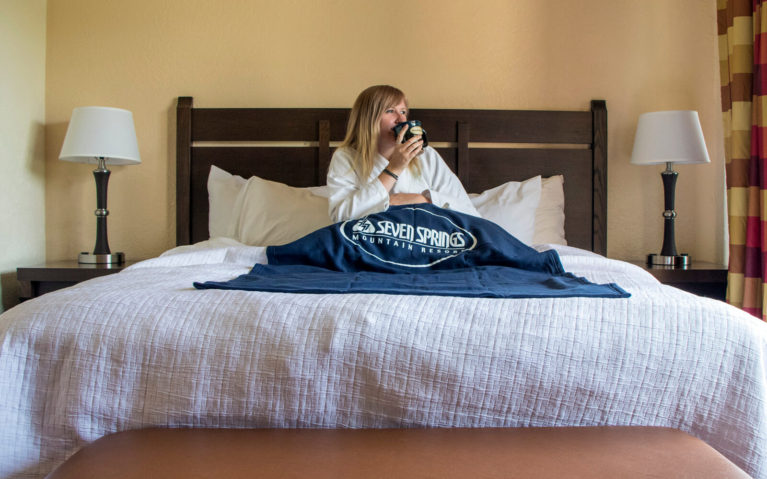 Lindsay Sitting in Bed at Seven Springs with a Cup of Coffee :: I've Been Bit! Travel Blog
