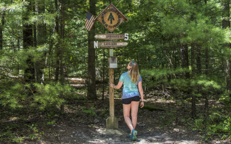 Lindsay Standing at the Midpoint of the Appalachian Trail :: I've Been Bit! Travel Blog