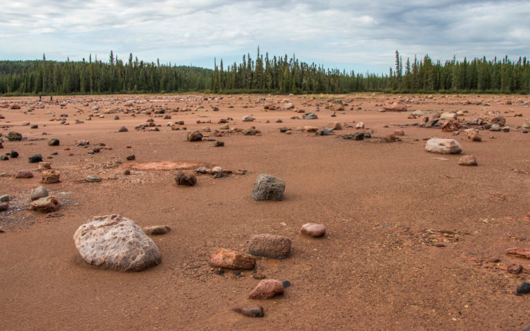 Glacial Erratics Scattered Across the Rust-Coloured Ground of Grosbeak Lake :: I've Been Bit! Travel Blog