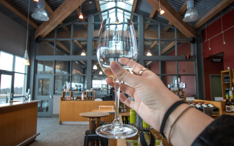 Hand Holding a Glass Inside of Fielding Estates Winery :: I've Been Bit! Travel Blog