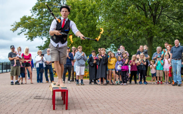 Busker stepping on Glass Shards while Juggling Flaming Batons at the Amherstburg Uncommon Festival :: I've Been Bit! Travel Blog