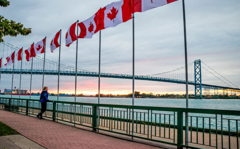 Lindsay on the Riverfront Trail Looking Out at the Ambassador Bridge :: I've Been Bit! Travel Blog