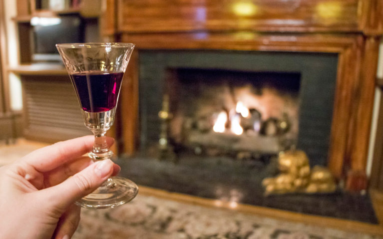 Glass of Port Wine in Front of the Fire Place at The Martha Washington :: I've Been Bit! Travel Blog