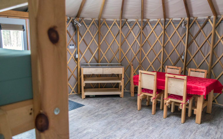 View inside a Yurt in Killarney Provincial Park with Table, Counter and Bed :: I've Been Bit! Travel Blog
