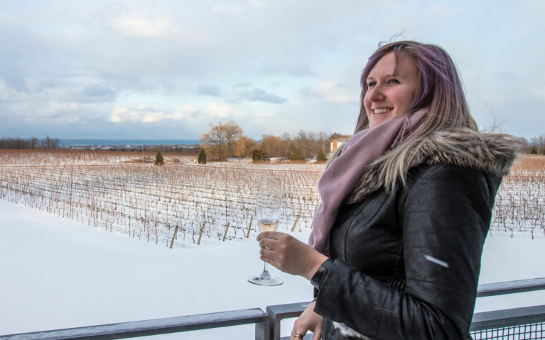 Lindsay with a Glass of Wine in Hand Overlooking a Vineyard :: I've Been Bit! Travel Blog