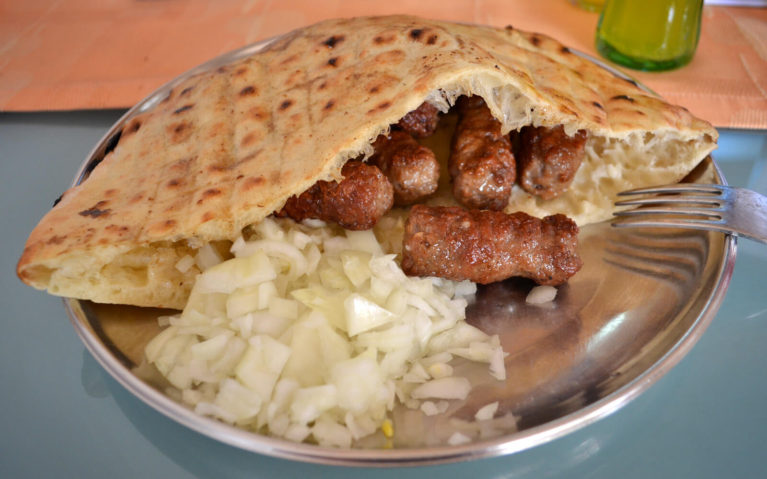 Ćevapi with onions at a cafe in Sarajevo :: I've Been Bit! Travel Blog