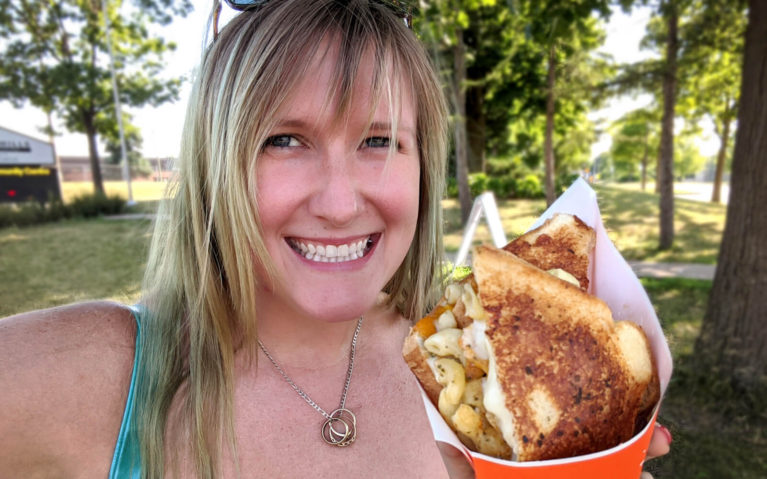 Lindsay Smiling with Her Kitchener Food Truck Eats :: I've Been Bit! Travel Blog
