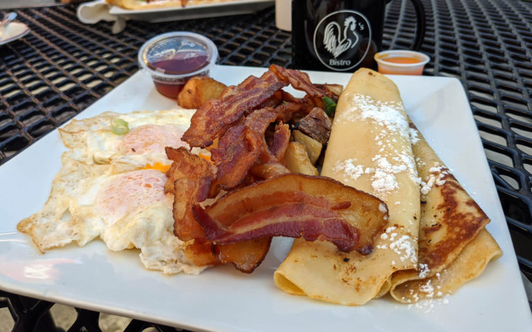 Eggs, Bacon, Home Fries and Finnish Pancakes on a White Plate :: I've Been Bit! Travel Blog