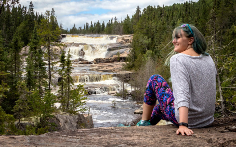 Lindsay Sitting In Front of Dog Falls in Thunder Bay :: I've Been Bit! Travel Blog