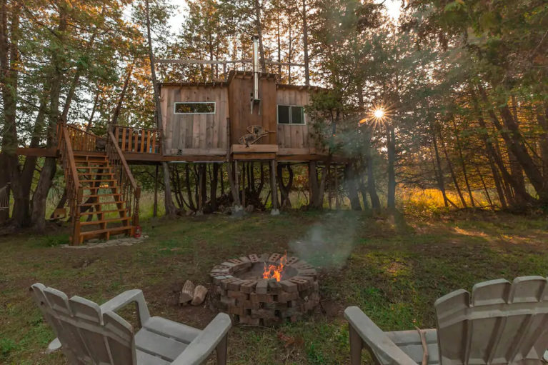 View of the Ottawa Treehouse Cabin from the Fire Pit - Image from Airbnb :: I've Been Bit! Travel Blog