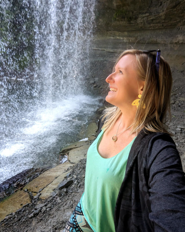 Lindsay Under Bridal Veil Falls on Manitoulin Island :: I've Been Bit! Travel Blog