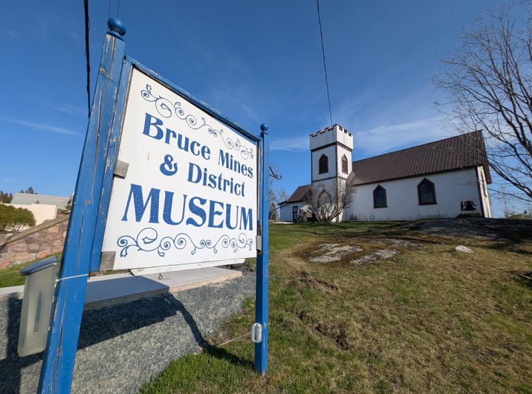 Bruce Mines Museum Sign With the Building in the Background :: I've Been Bit! Travel Blog