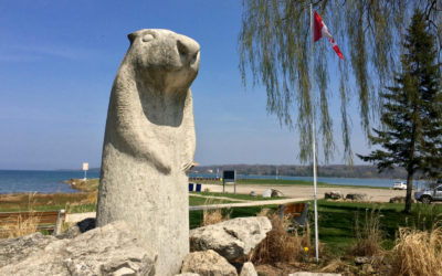 View of Bluewater Park Beside the Wiarton Willie Monument with the Canadian Flag in the Background :: I've Been Bit! Travel Blog