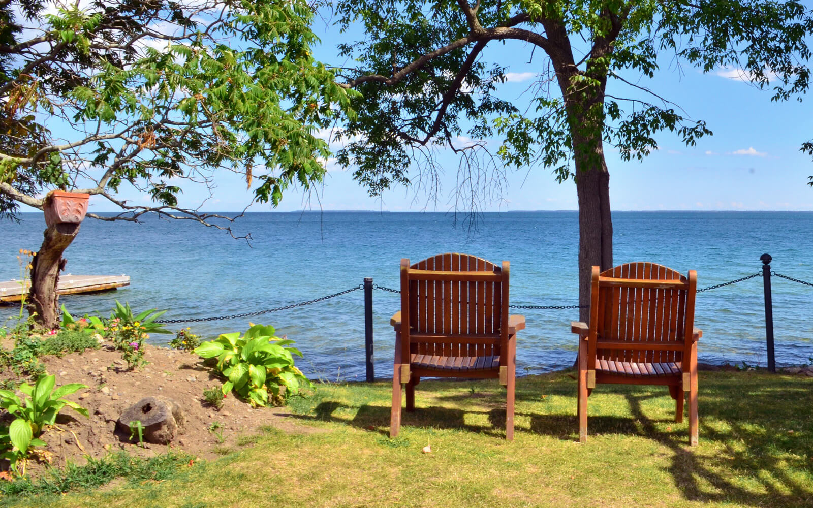 Two Outdoor Chairs Along the Beautiful Shoreline of Prince Edward County Ontario :: I've Been Bit! Travel Blog