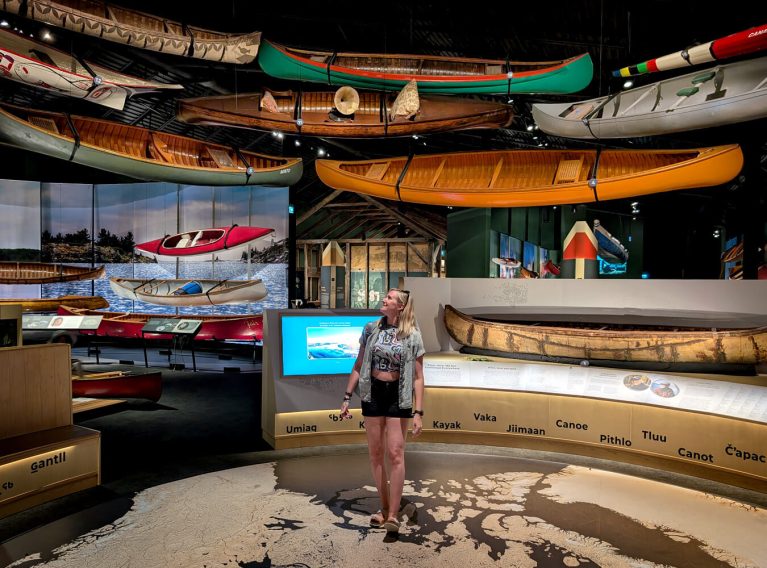 Lindz Standing in the New Canadian Canoe Museum's Great Hall :: I've Been Bit! Travel Blog
