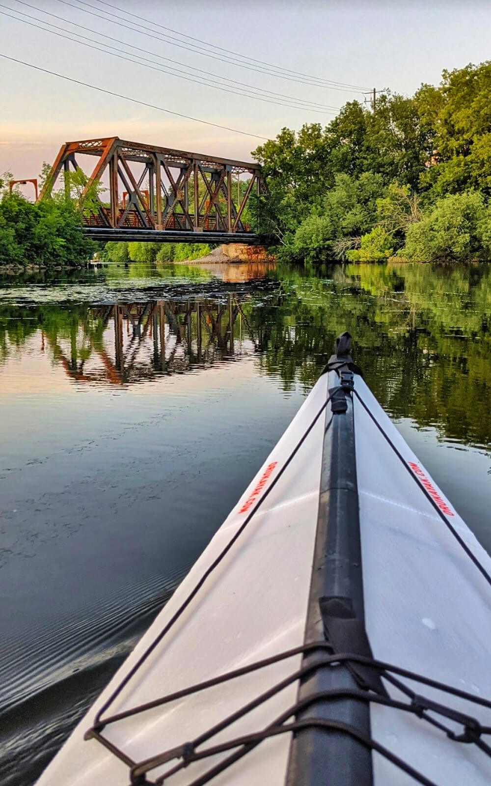 Kayak Facing the Railway Bridge on Little Lake in Peterborough at Golden Hour :: I've Been Bit! Travel Blog