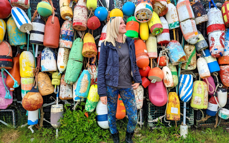 Lindz Posing In Front of the Buoy Wall at Yarmouth Bar :: I've Been Bit! Travel Blog