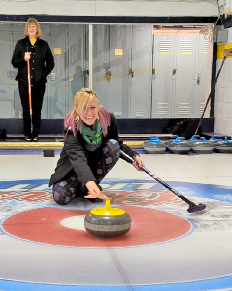 Lindsay Throwing a Rock at the Fort William Curling Club :: I've Been Bit! Travel Blog