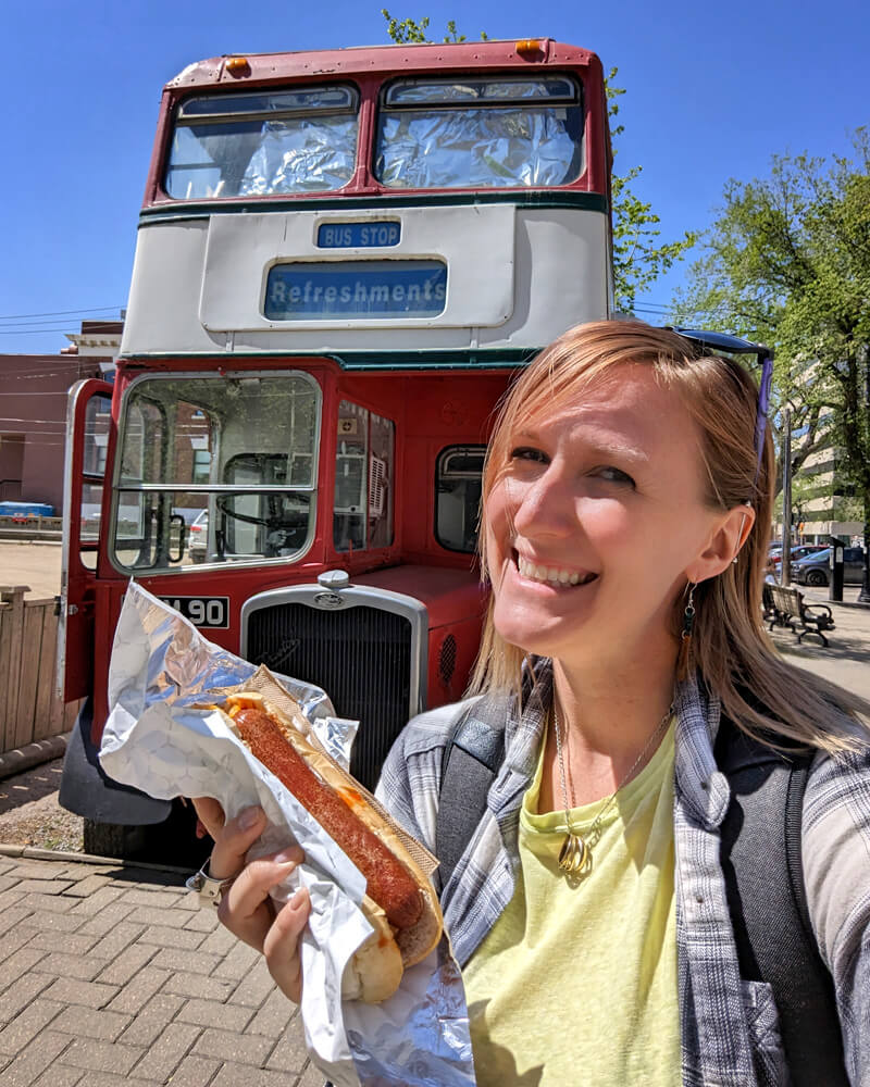 Lindsay with a Riverbank Frank in Front of Bus Stop Refreshments :: I've Been Bit! Travel Blog