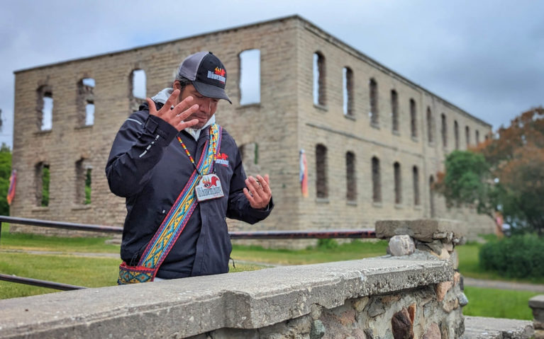 Jack Standing in Front of the Remains of the Residential School in Wikwemikong :: I've Been Bit! Travel Blog