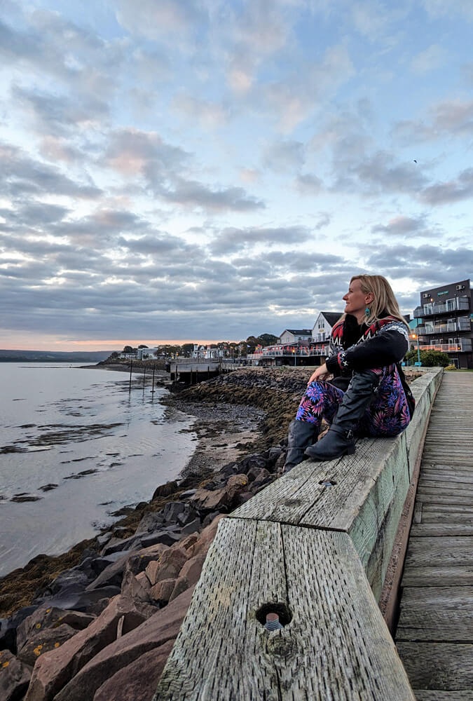 Lindsay Sitting Along the Waterfront in Digby at Sunrise :: I've Been Bit! Travel Blog