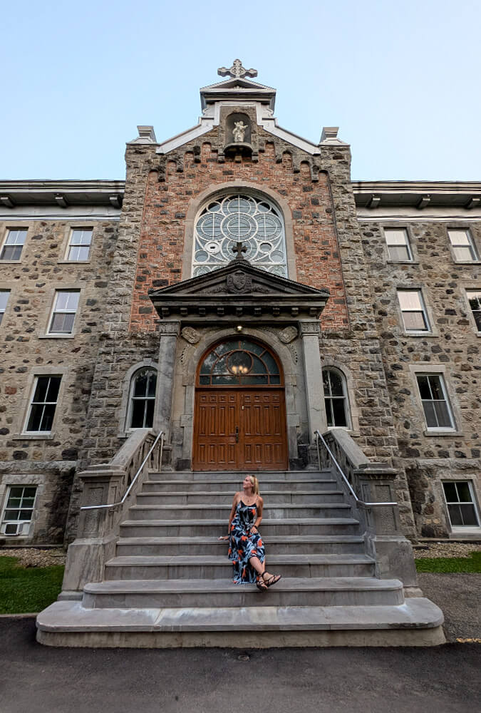 Lindz Sitting Outside L'Abbaye d'Oka :: I've Been Bit! Travel Blog