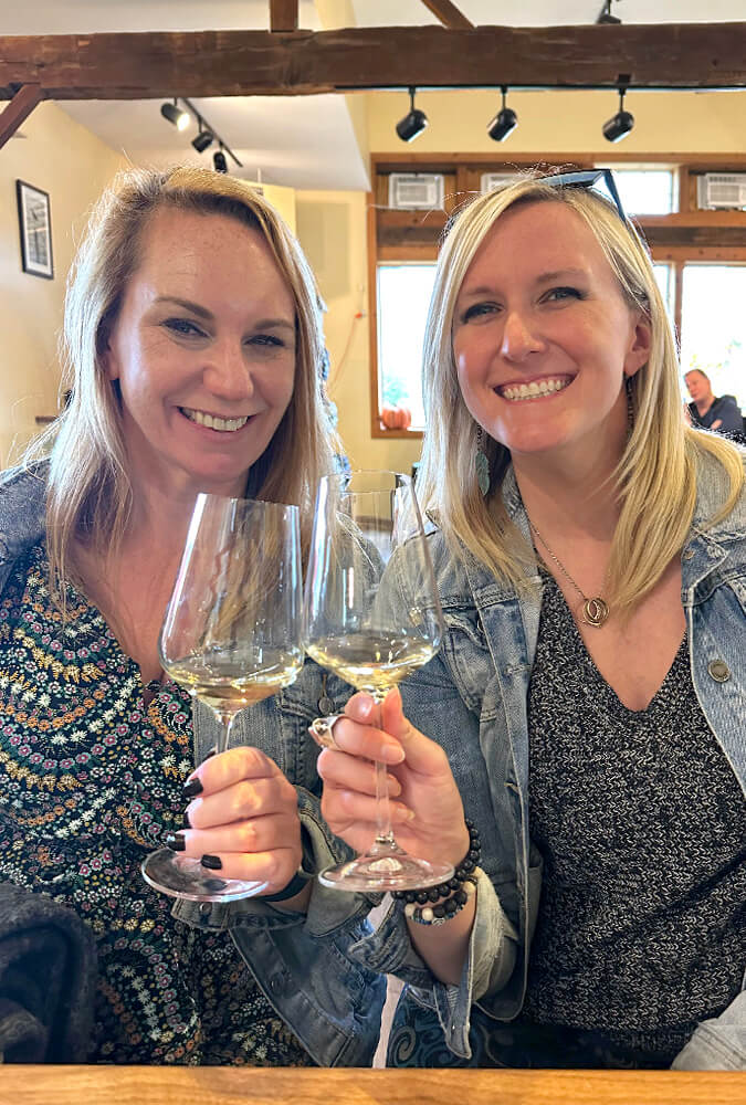 Kat and Lindz Cheersing with Chardonnay at Heron Hill Vineyards :: I've Been Bit! Travel Blog