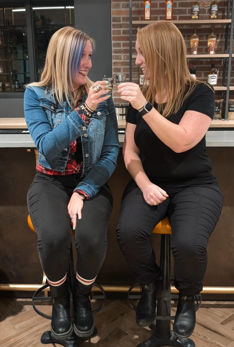 Lindz and Kat Cheersing at Mariana Distillery :: I've Been Bit! Travel Blog