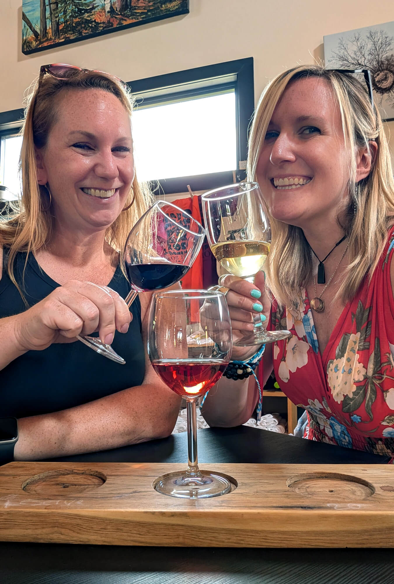 Kat & Lindz Cheersing Over a Flight at Little Red Wagon Winery :: I've Been Bit! Travel Blog